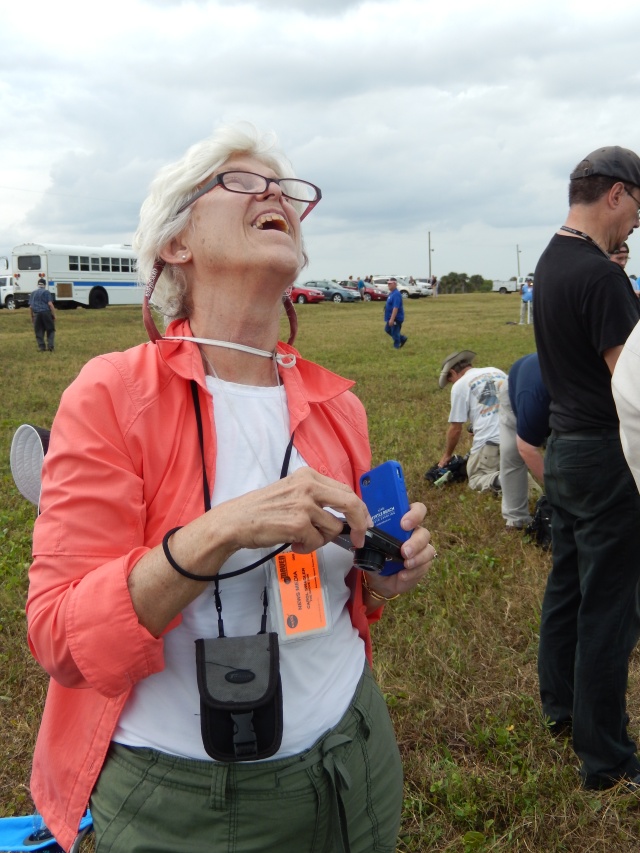 THE CAUSEWAY, KENNEDY SPACE CENTER, FLORIDA == Carol Anne watches MAVEN seconds before it disappears into clouds after the successful on time launch at 1:28pm, Monday, November 18, 2013. 